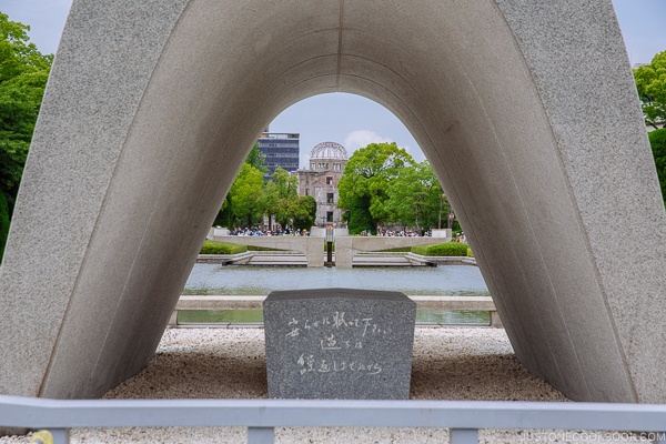 Memorial Cenotaph at Hiroshima Peace Memorial Park looking at Atomic Bomb Dome | JustOneCookbook.com