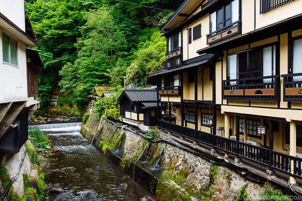 view of river and Shinmei-kan 山の宿 新明館 - Kurokawa Onsen Travel Guide | justonecookbook.com