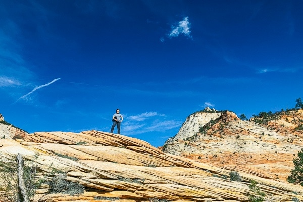 Nami standing on sandstone hills off Zion-Mount Carmel Highway - Zion National Park Travel Guide | justonecookbook.com