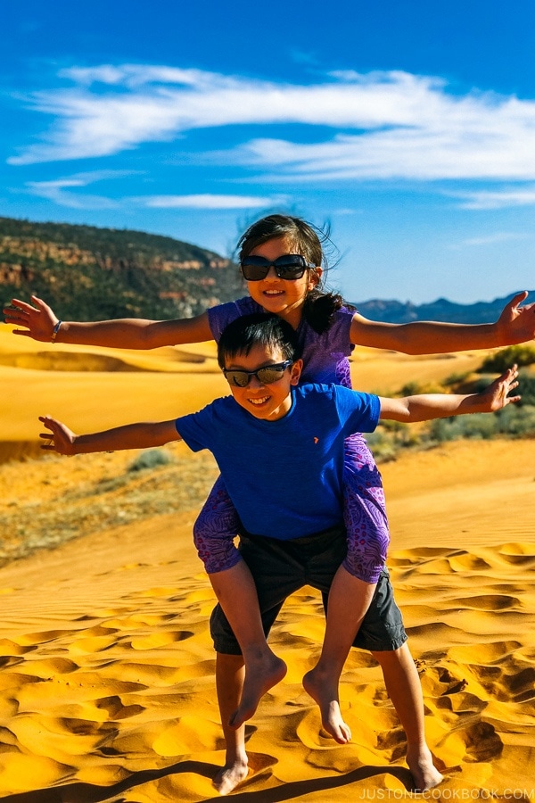 child playing in sand dune - Coral Pink Sand Dunes State Park | justonecookbook.com