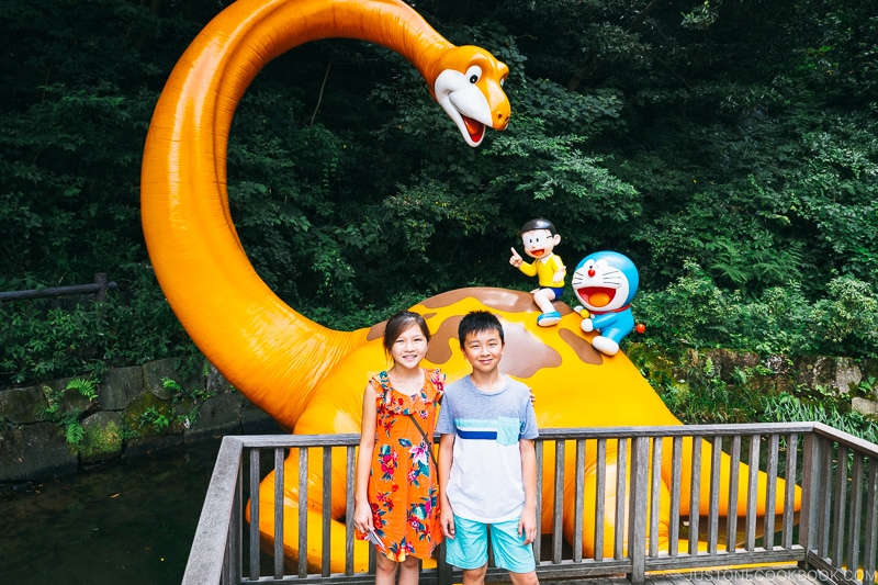 children posing in front of dinosaur - Fujiko F Fujio Museum | www.justonecookbook.com 