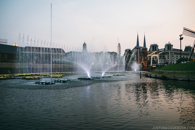 water fountain spraying from canal lite up with lights