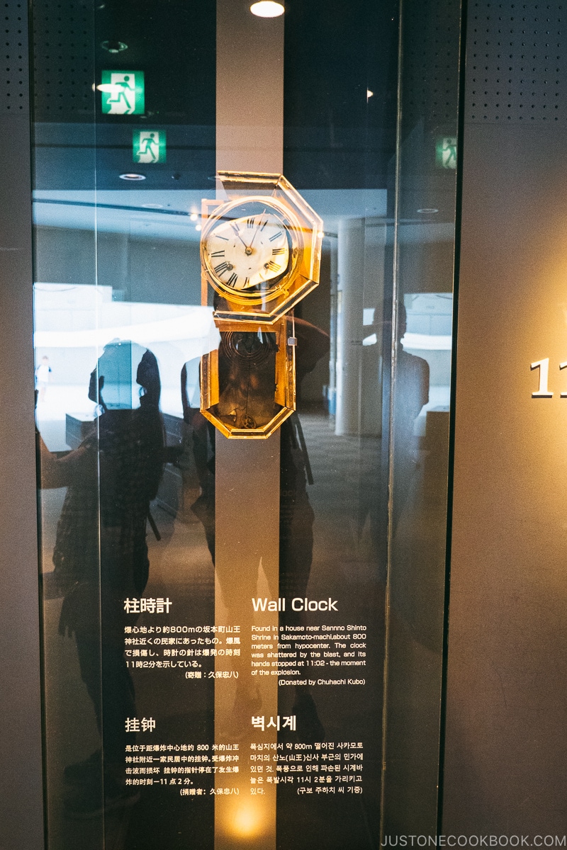 broken wall clock in a display case