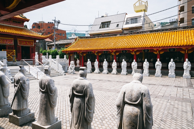 the courtyard lined with statues at Nagasaki Koshibyo Confucius Shrine and Historical Museum of China