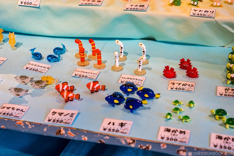 various sea creatures made with glass on a table