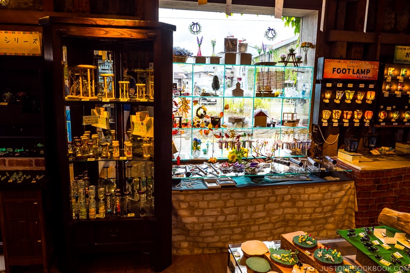 glass souvenirs inside cabinet and on display stands