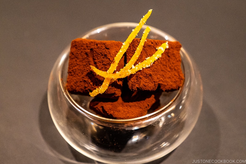 chocolate with candied orange in a glass bowl