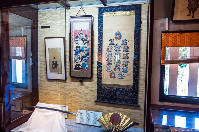 art scroll and knife in a display case