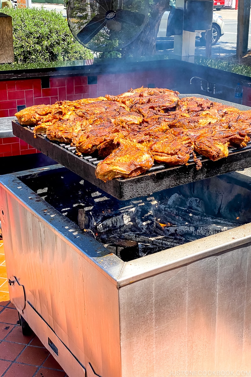 meat grilling over woodfire