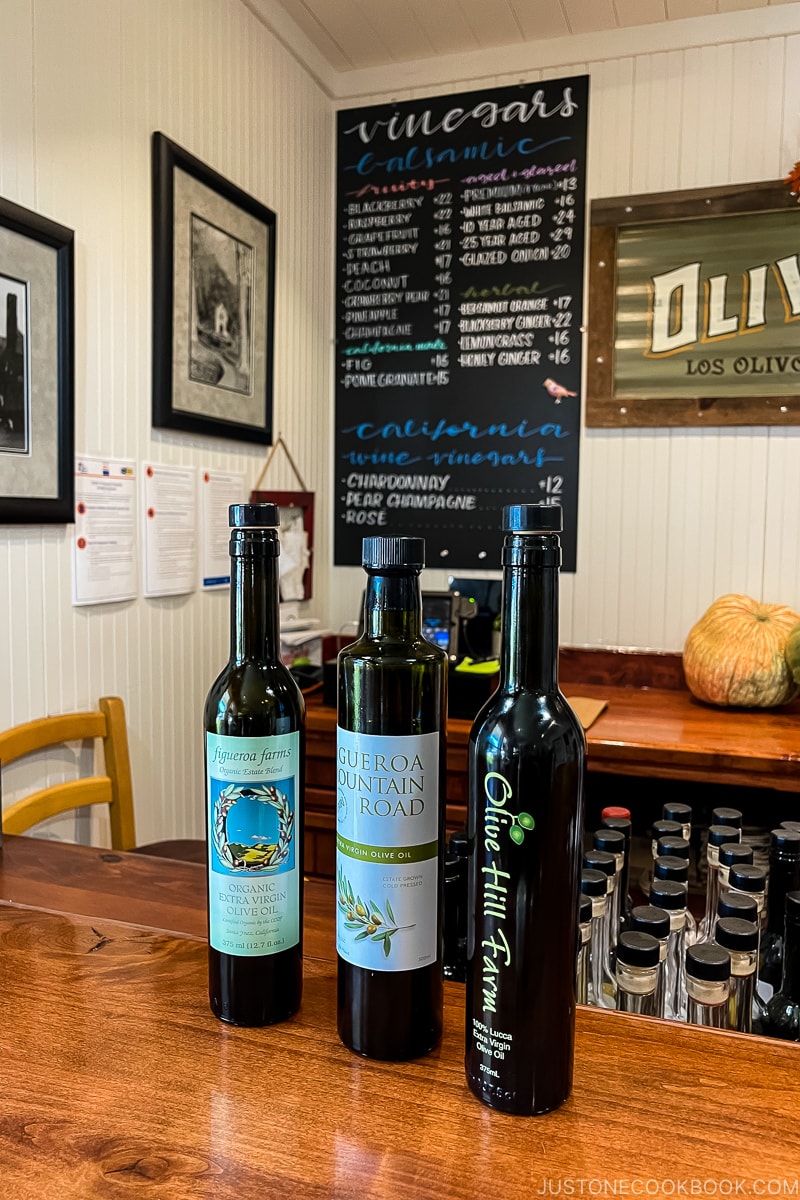 Olive oil bottles on a wood counter
