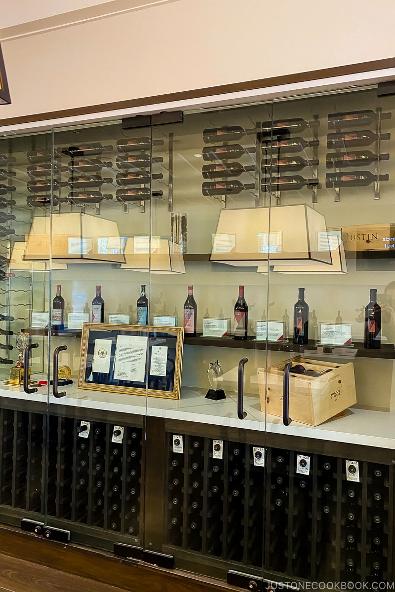 wine bottles in a glass display wall