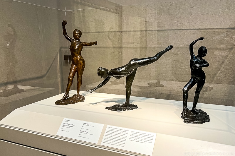 statues inside glass display case The Art Institute of Chicago