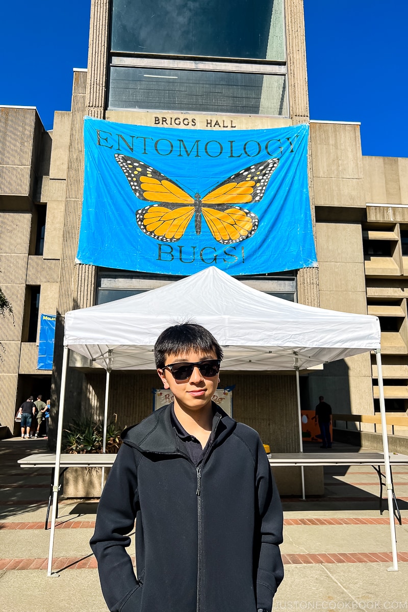 boy in front of Briggs Hall