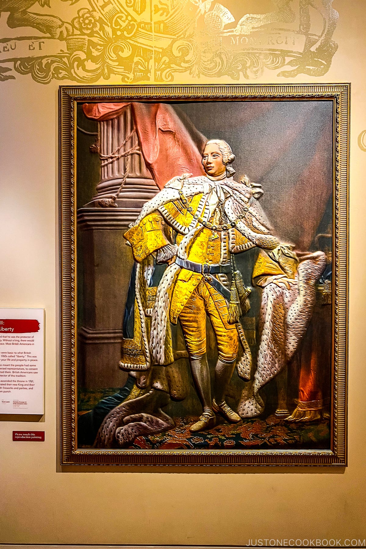 framed painting of a royal on a wall