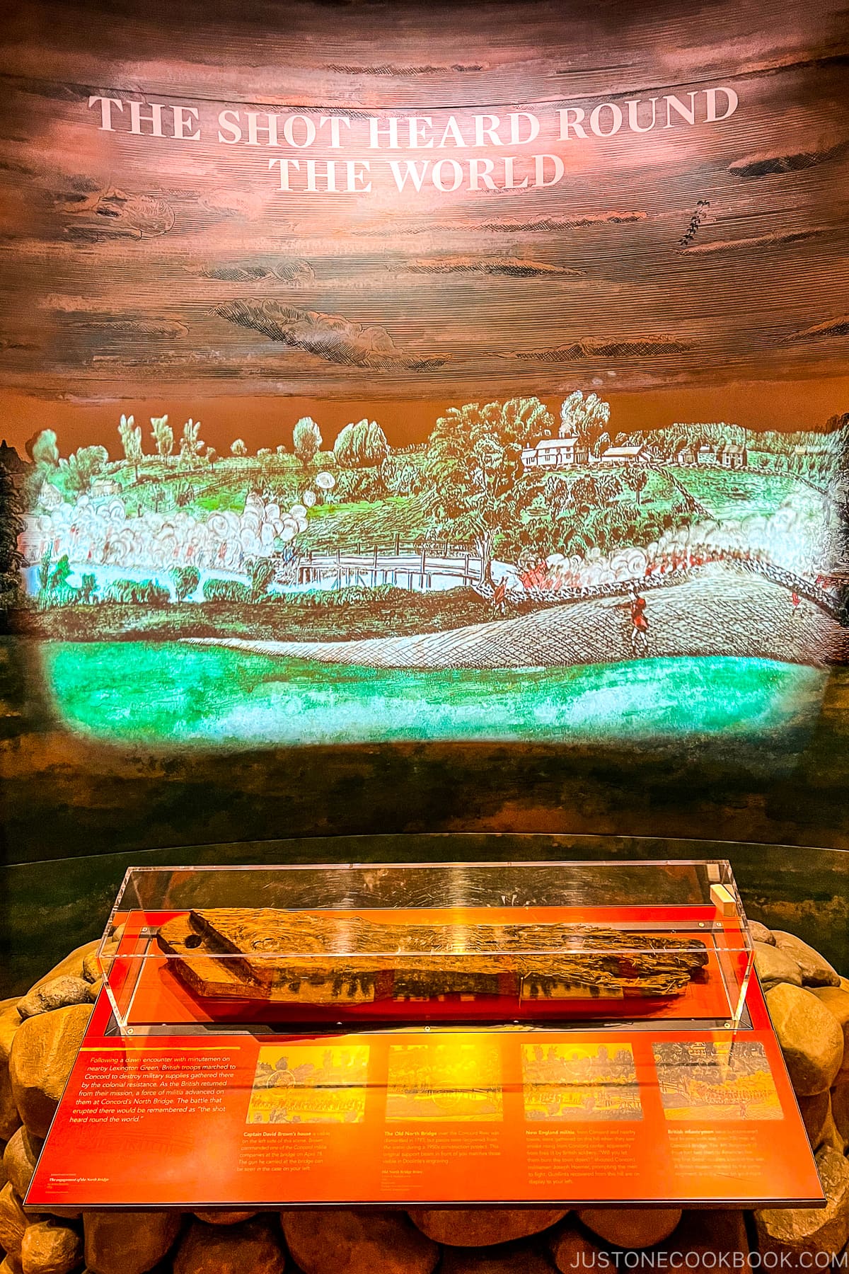 The Shot Heard Round the World text with painting of a hill below