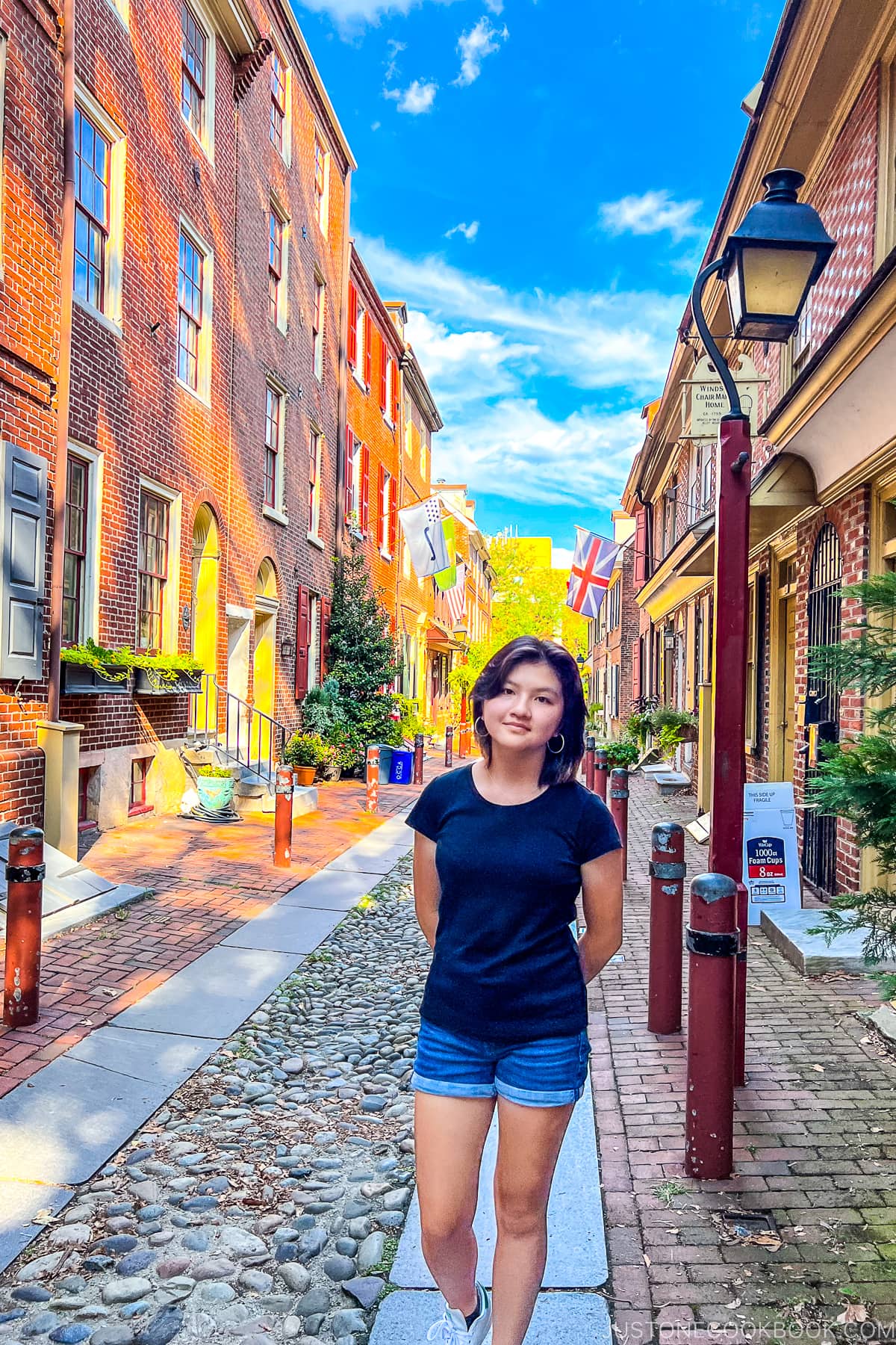 a girl standing on Elfreth's Alley