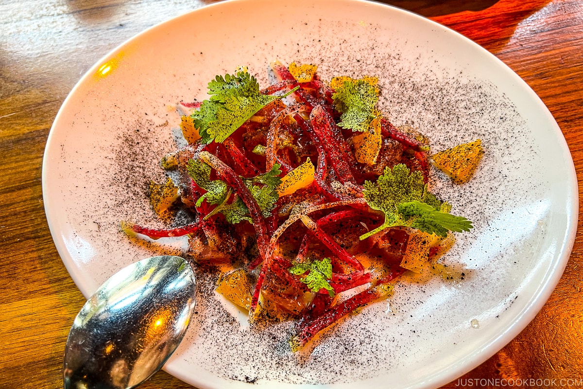 tuna crudo on a white plate