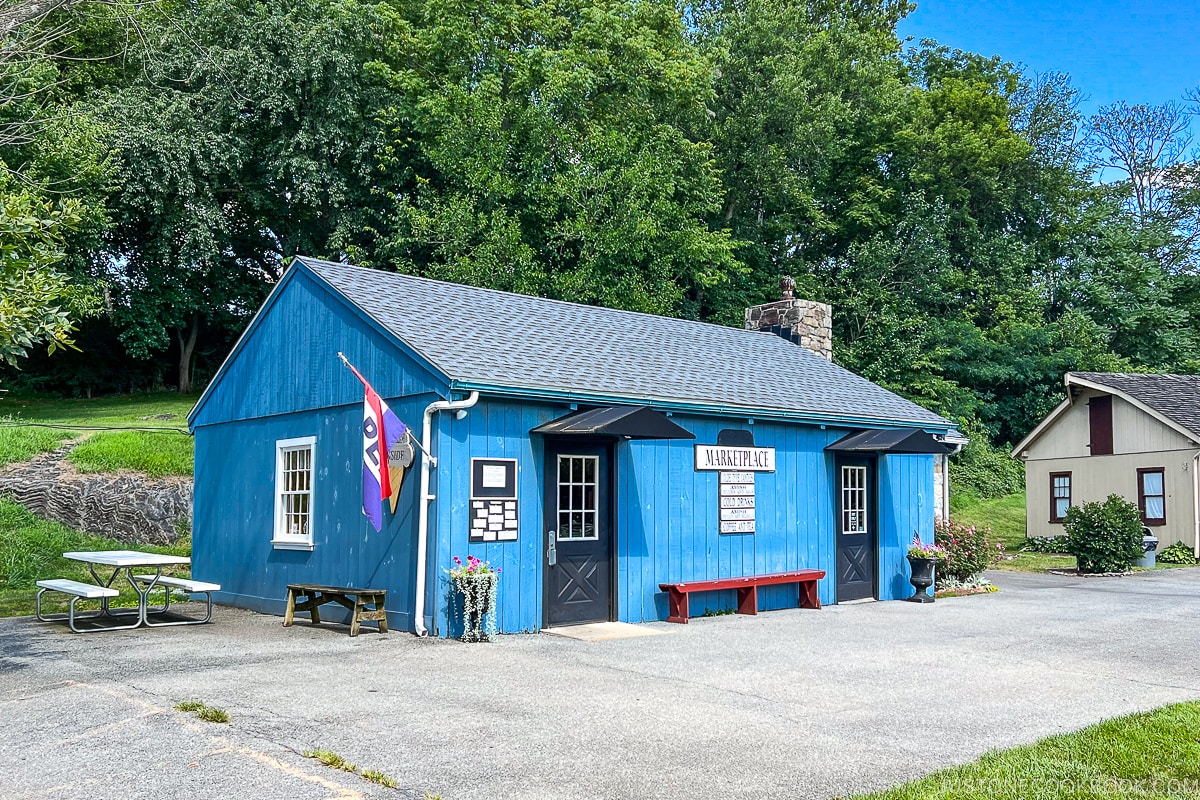 small blue structure with marketplace on it
