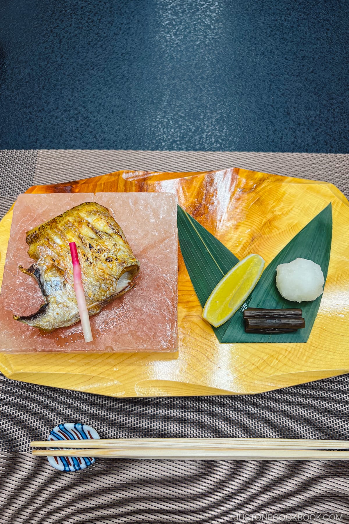 grilled fish on a rock salt plate