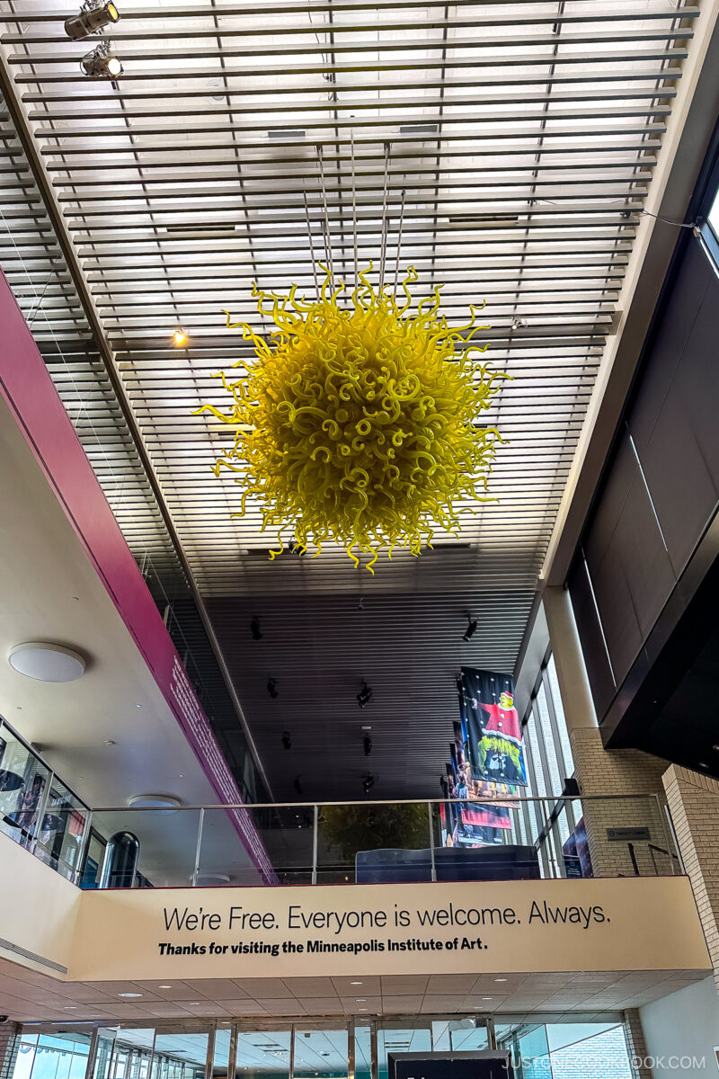Sunburst by Dale Chihuly hanging from the ceiling