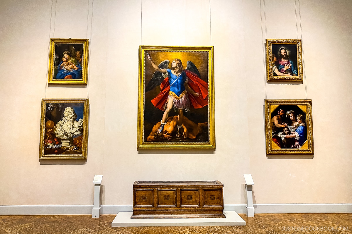 western paintings hanging on a wall
