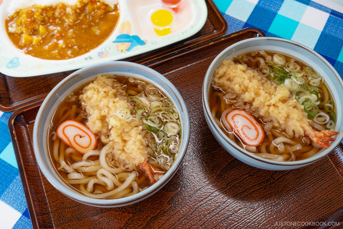 two bowls of udon in a tray