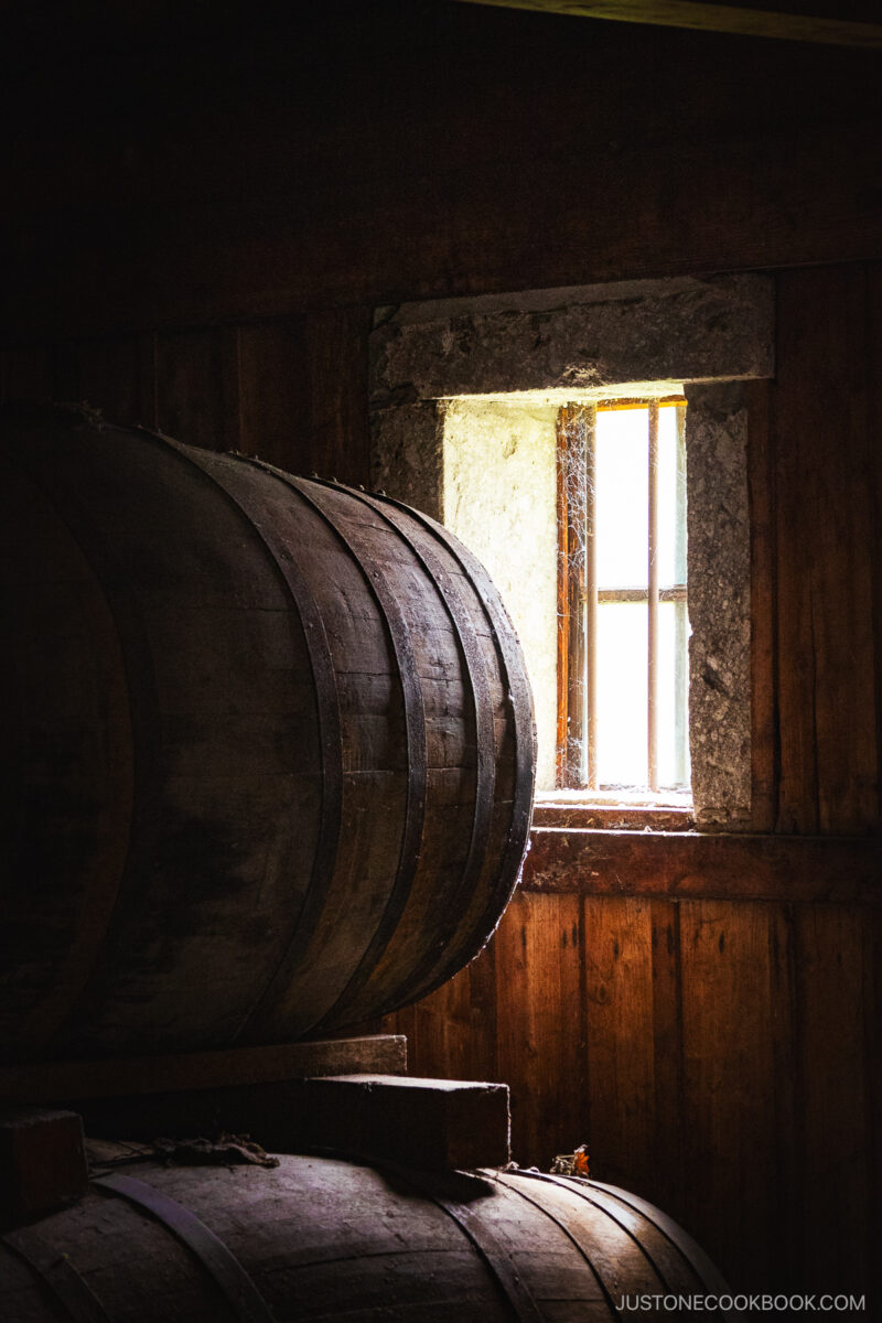 Whisky Kegs stored in a warehouse in front of a window