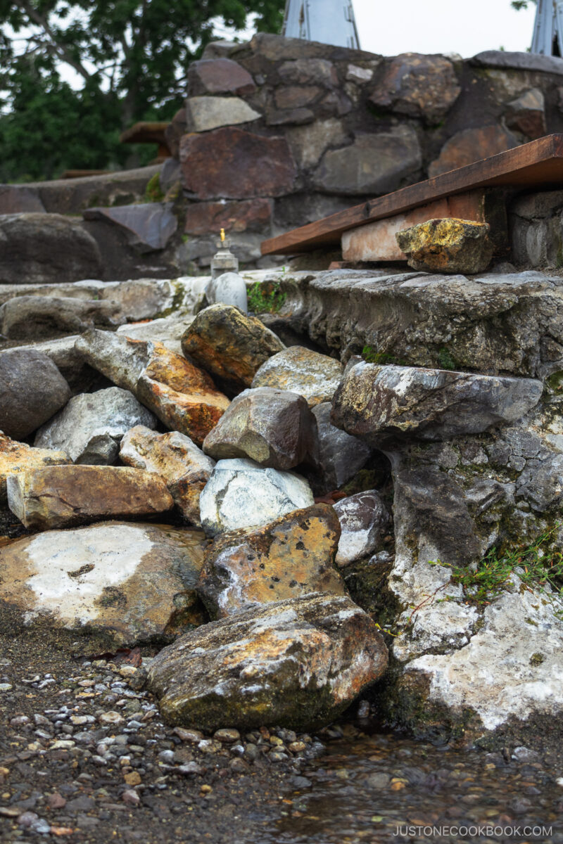Stones with natural onsen water flowing through them