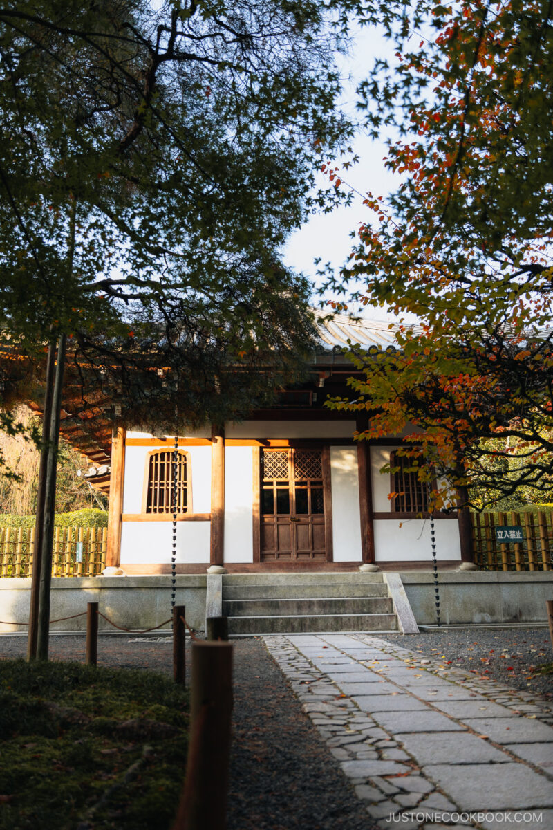 Wooden and white building that is closed off