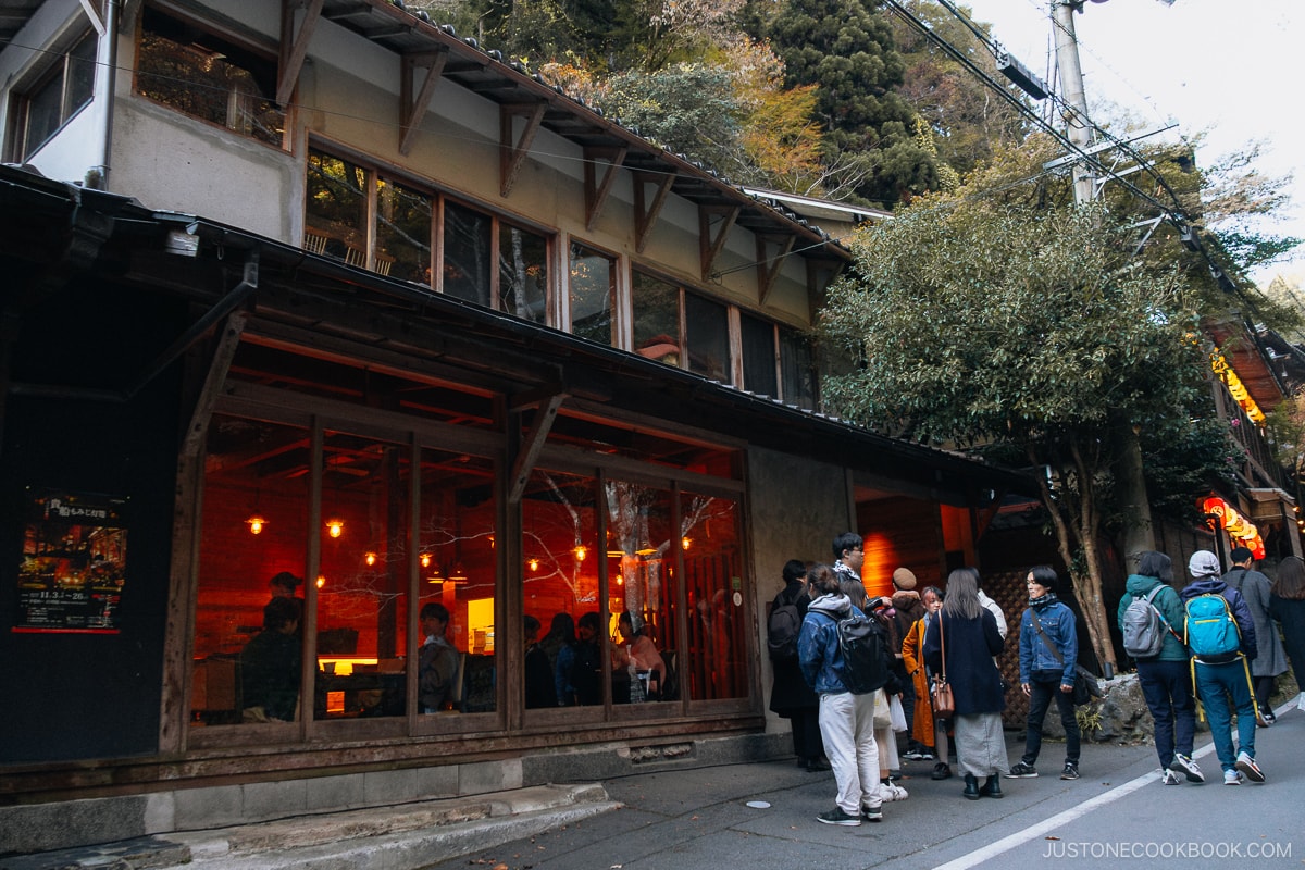 People lining up to enter a cafe