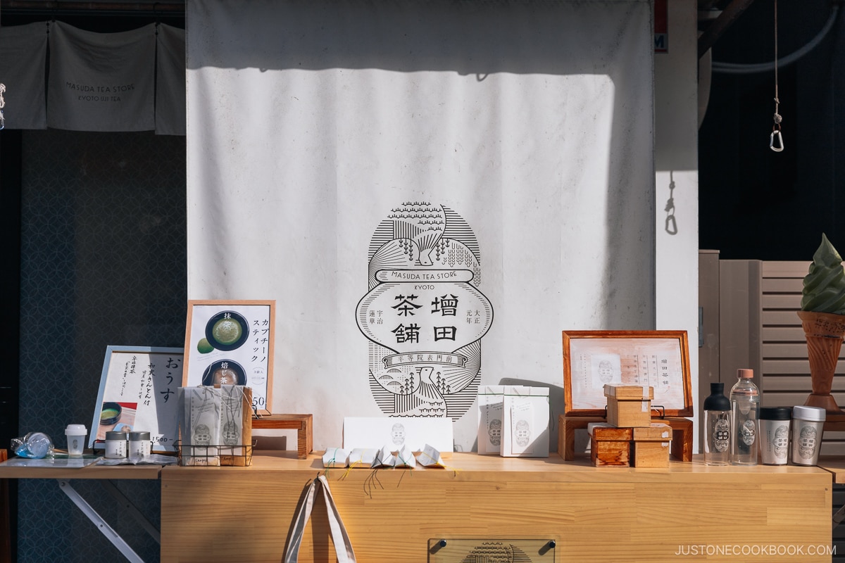 Tea store shop exterior with matcha items on display at the front
