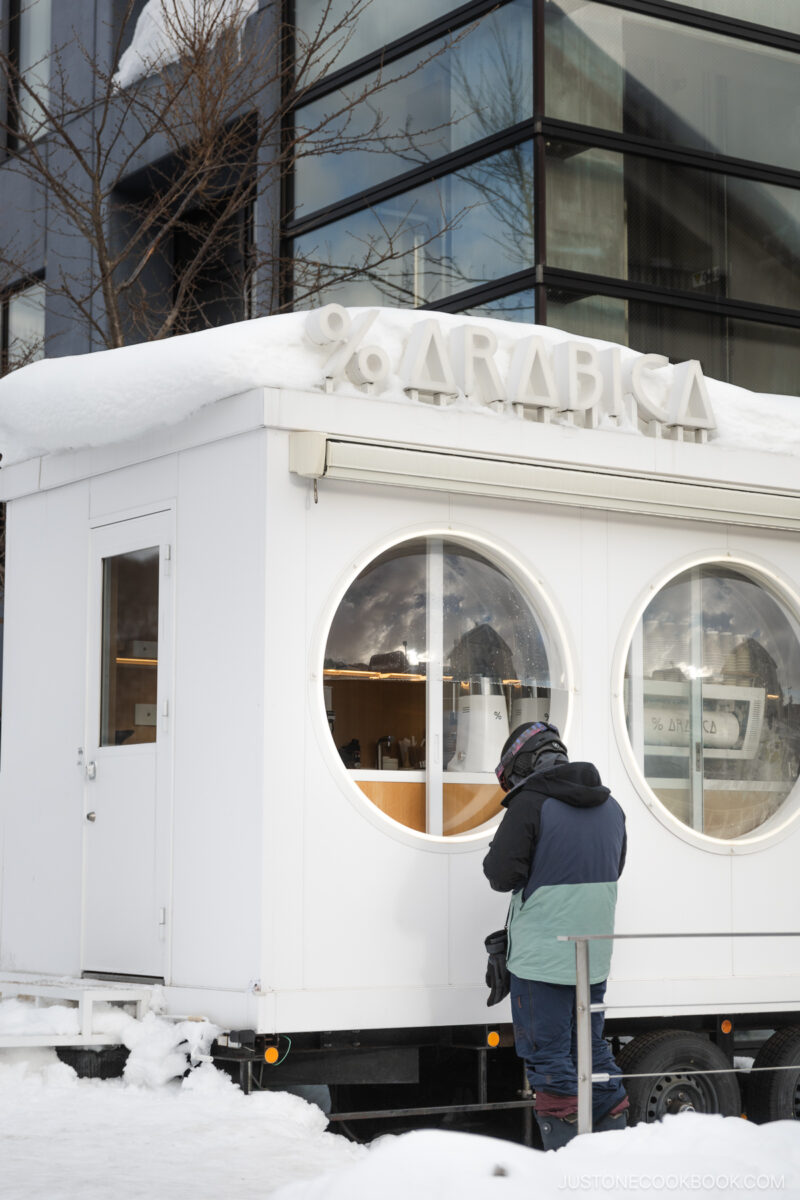 Person waiting for their coffee at %Arabica in Niseko