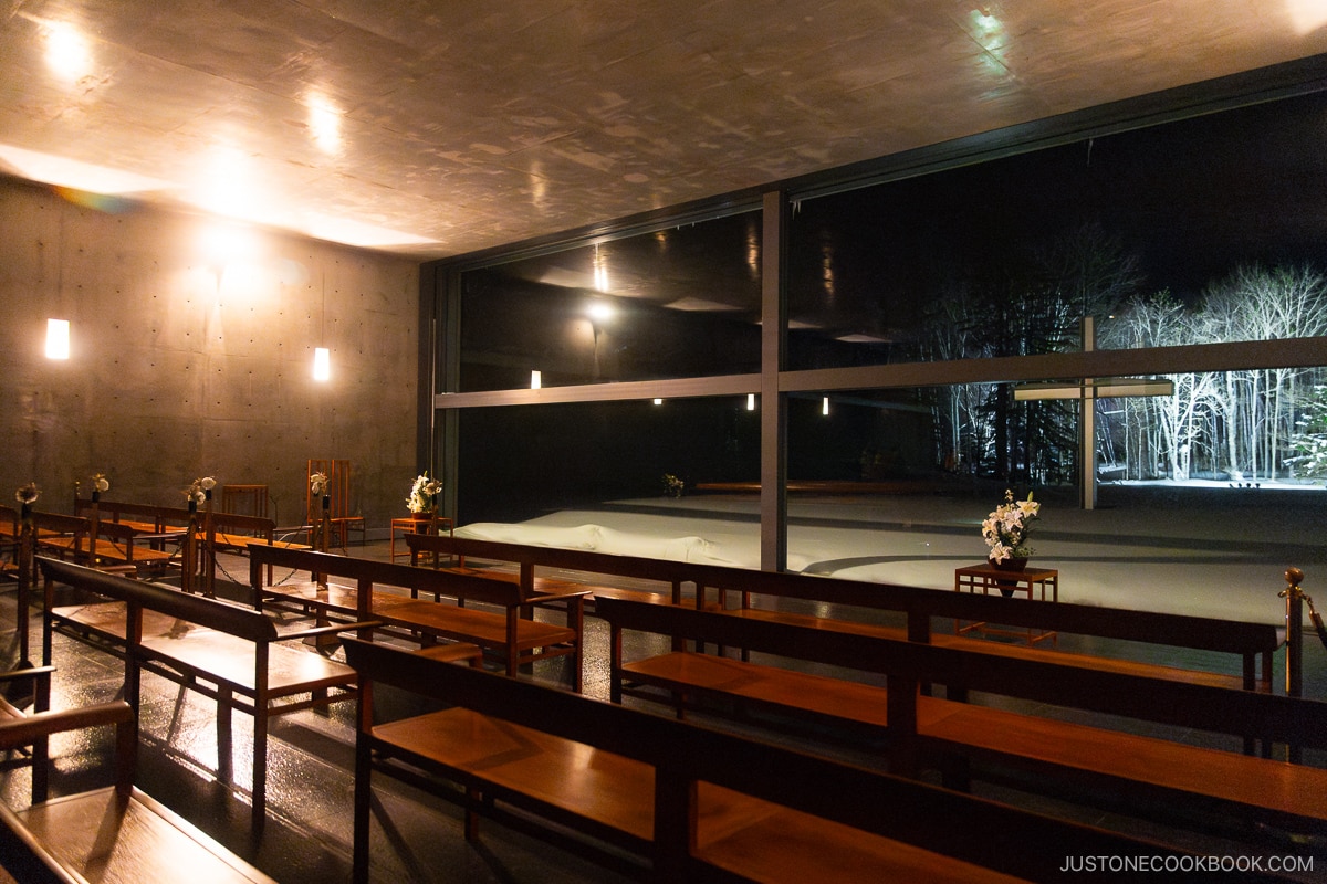 Chapel on the Water interior and cross outside in the snow