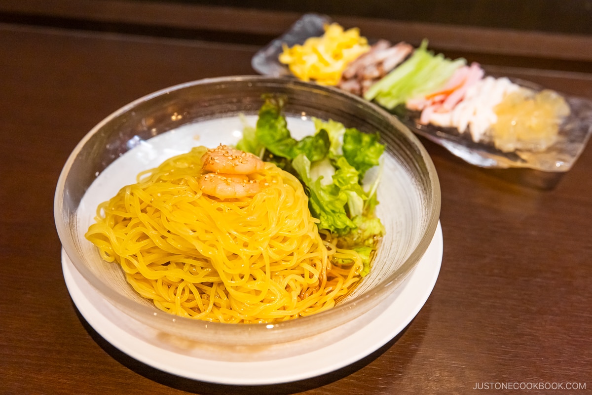 Glass bowl of Hiyashi Chuka topped with prawns