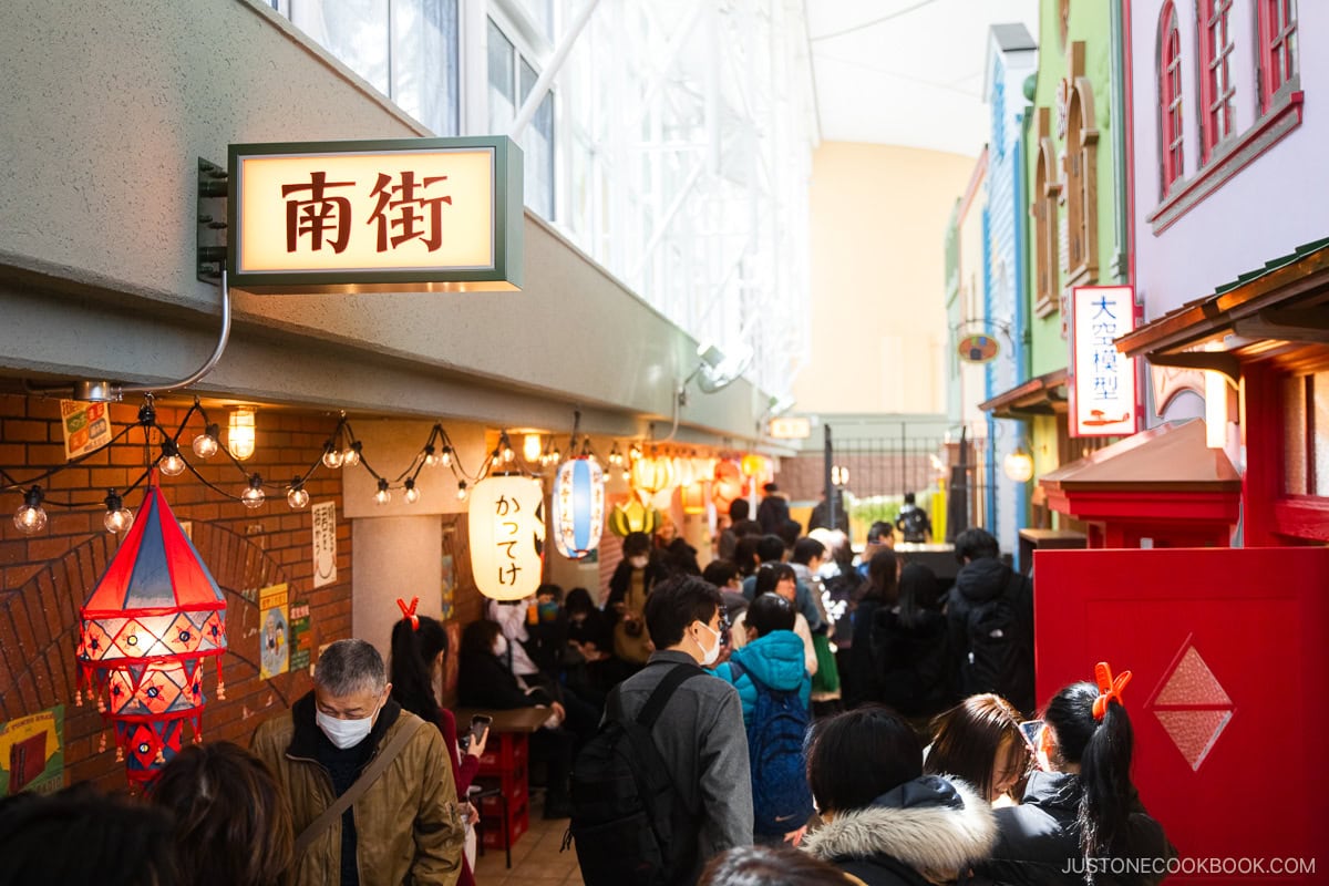 alley way with hanging lanterns and souvenir shops