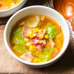 White ceramic bowls containing Bacon and Corn Miso Soup.