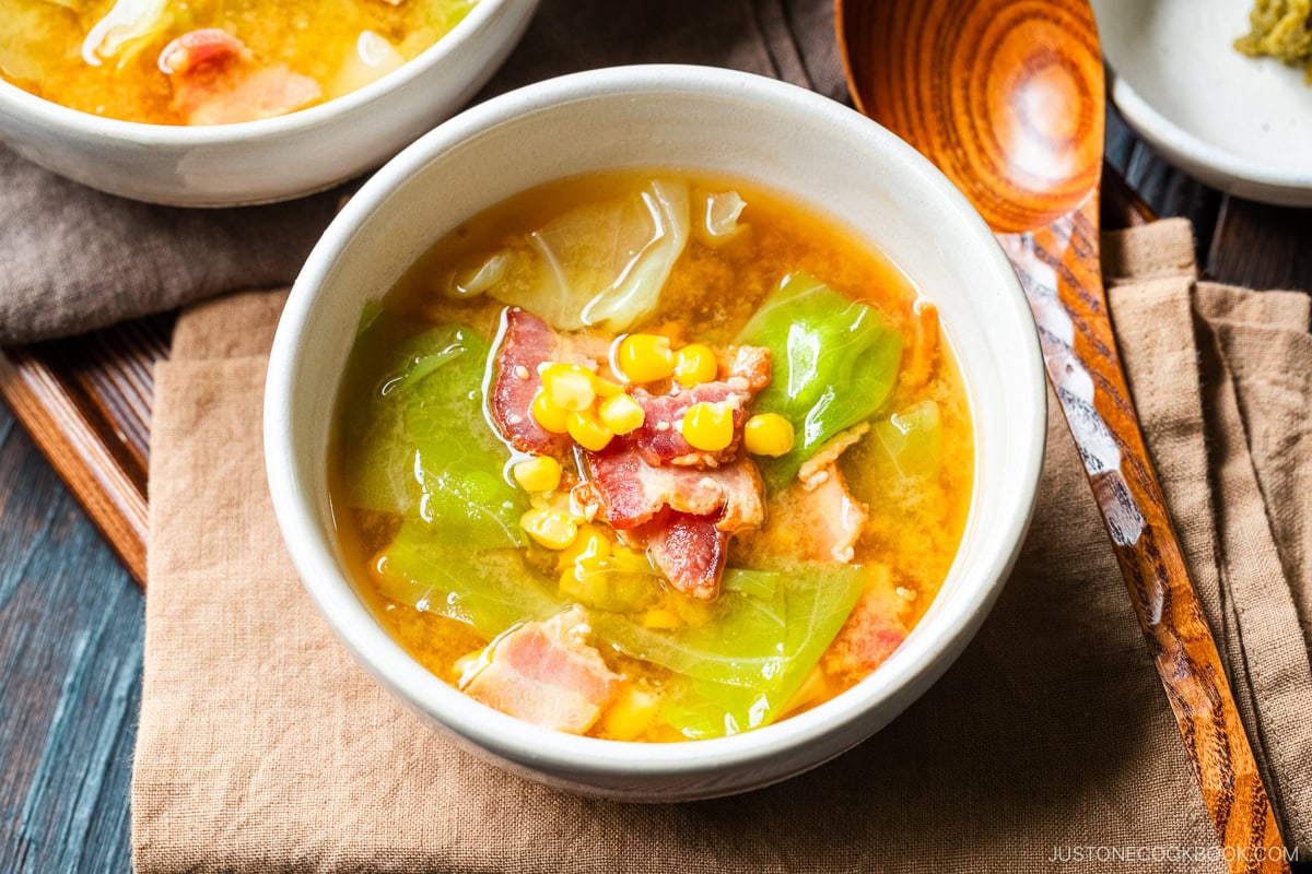 White ceramic bowls containing Bacon and Corn Miso Soup.