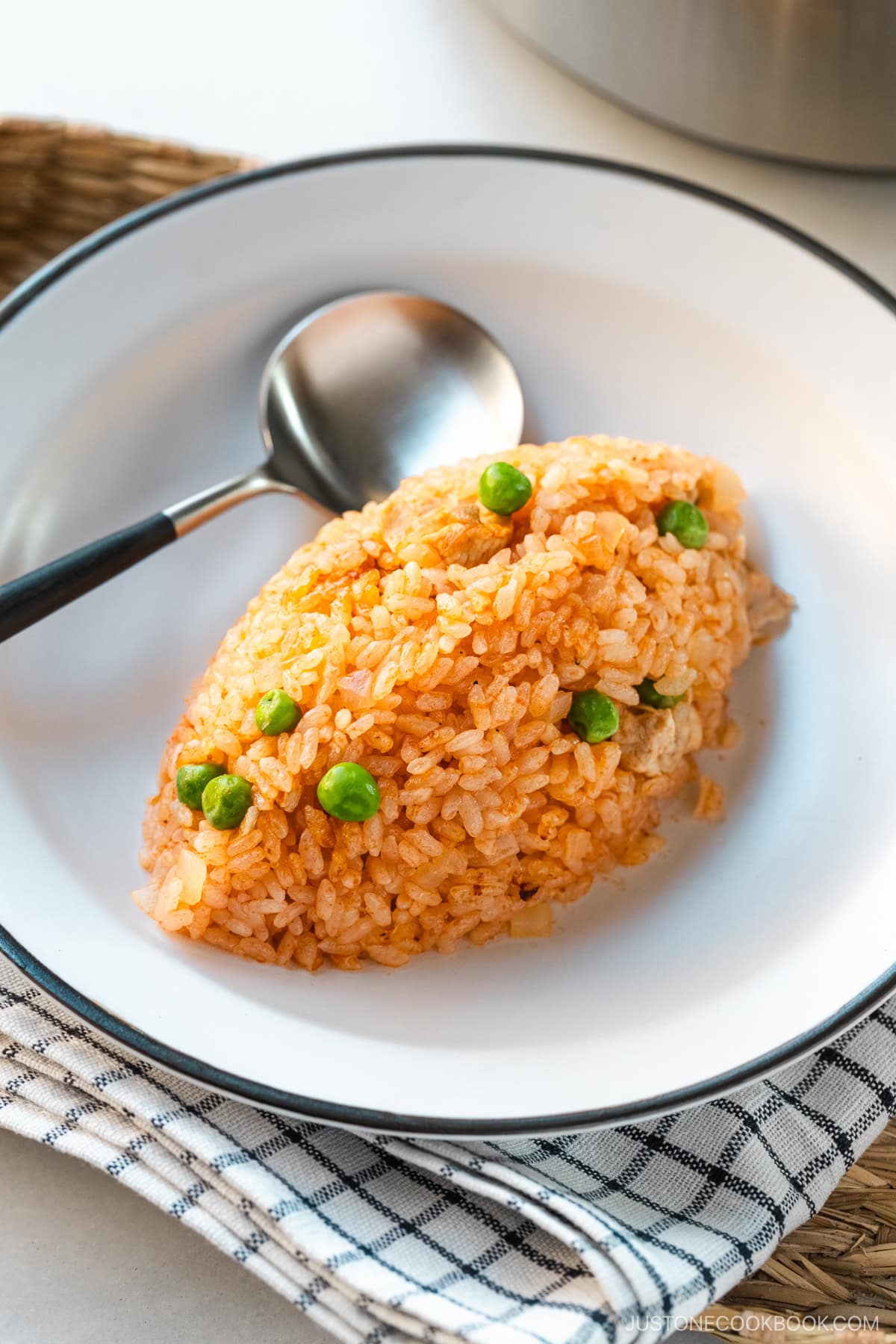 A white plate containing Rice Cooker Chicken Rice, seasoned with Japanese ketchup and Worcestershire sauce.