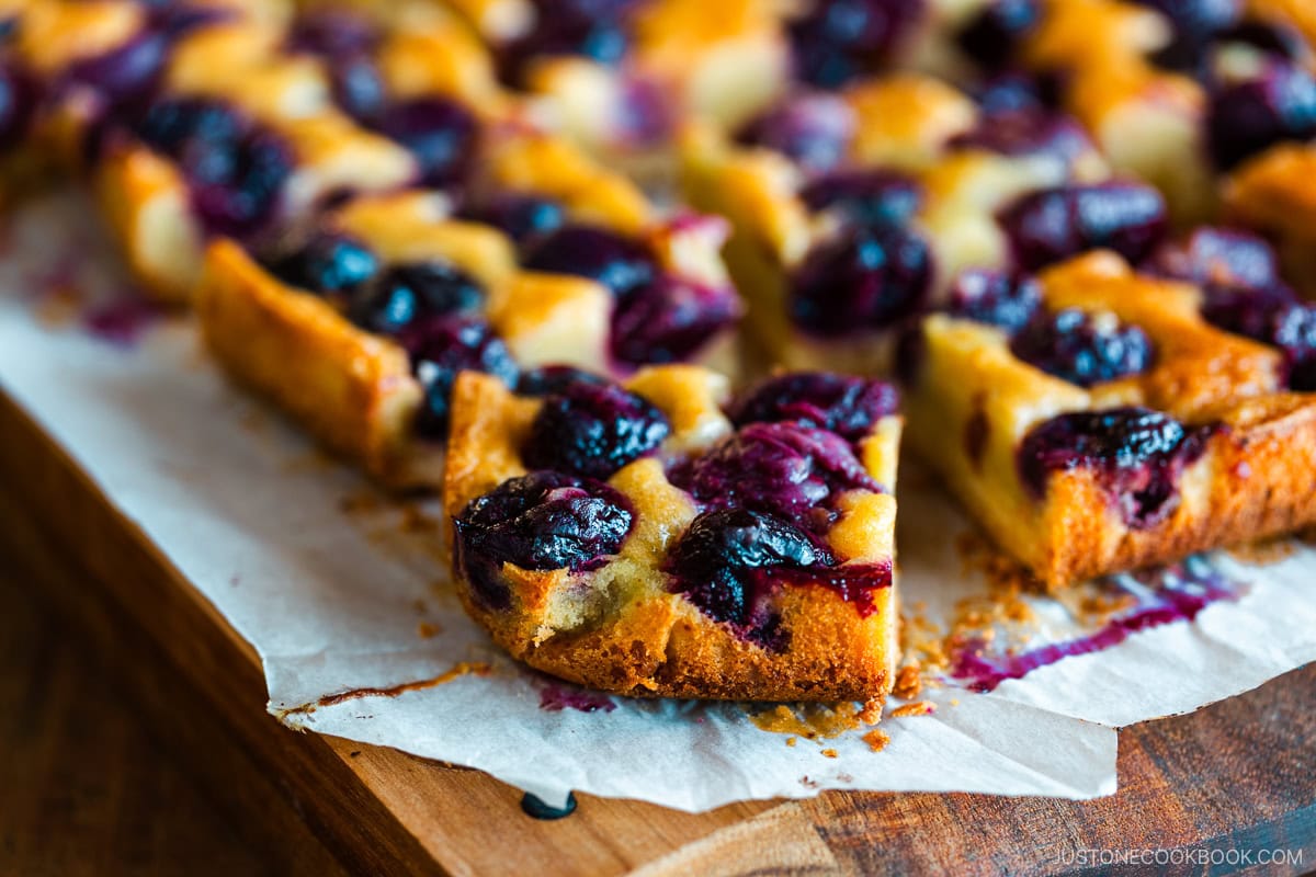 Cherry Bars | Easy Japanese Recipes at JustOneCookbook.com Cherry bards on top of a wooden cutting board.
