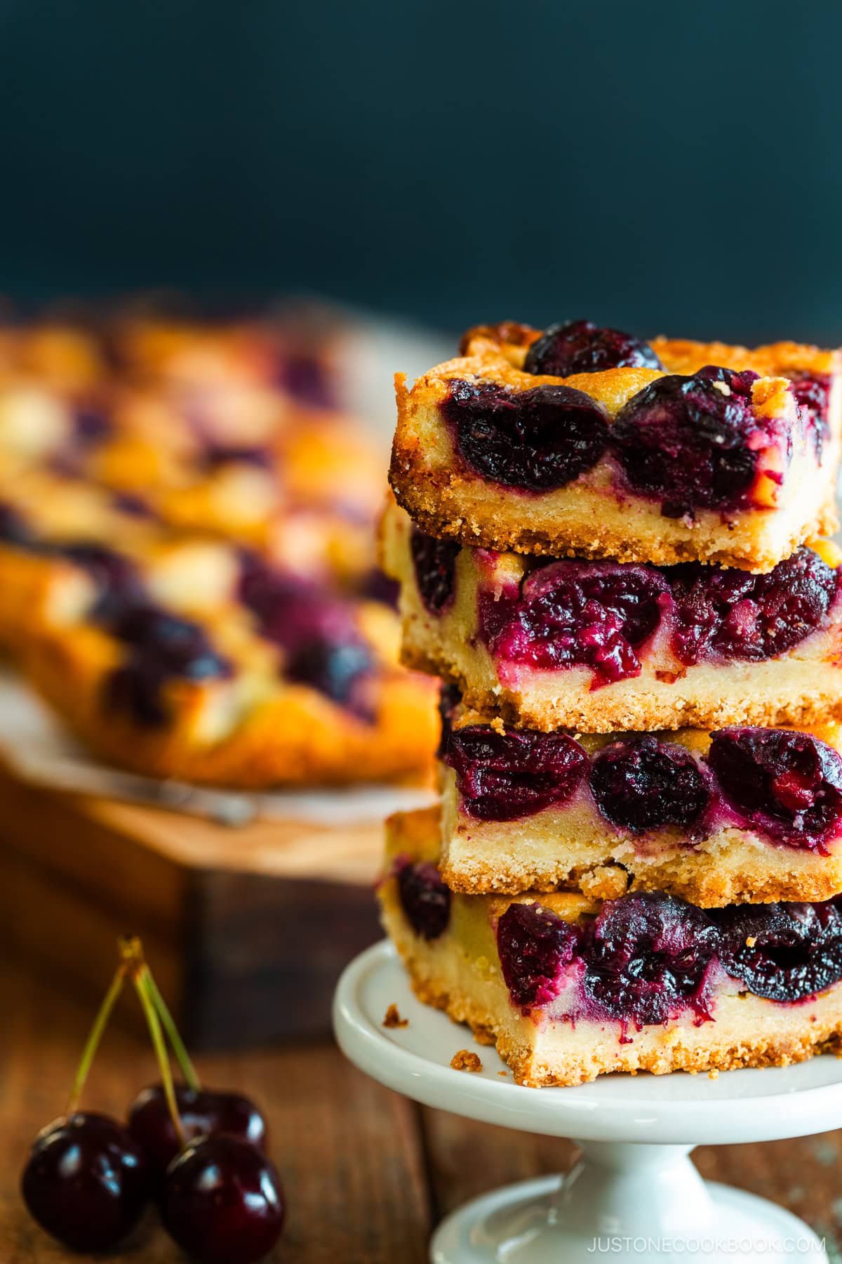 Cherry Bars | Easy Japanese Recipes at JustOneCookbook.com Cherry bards on top of a wooden cutting board.