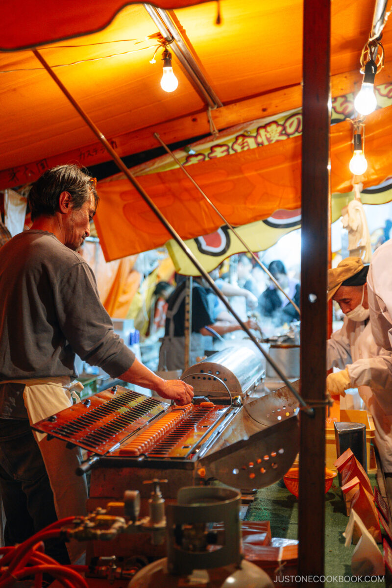Food stall vendor at night