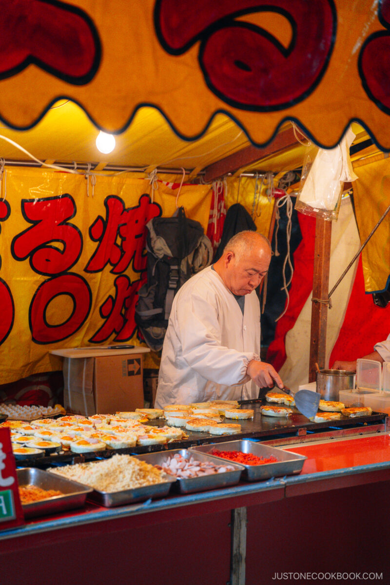 Food stall vendor at night