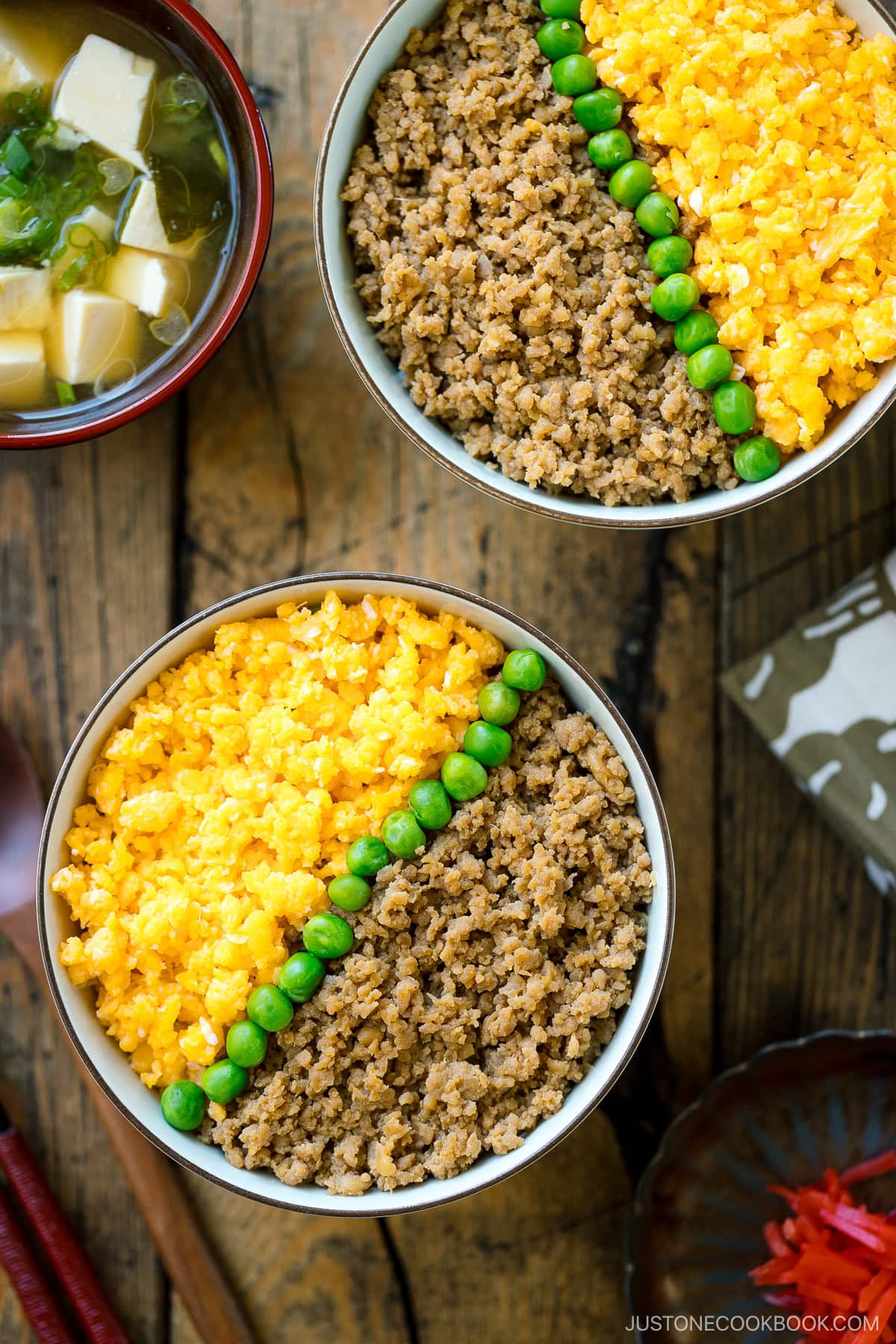 A bowl containing Soboro Don (seasoned ground chicken and scrambled egg over rice).