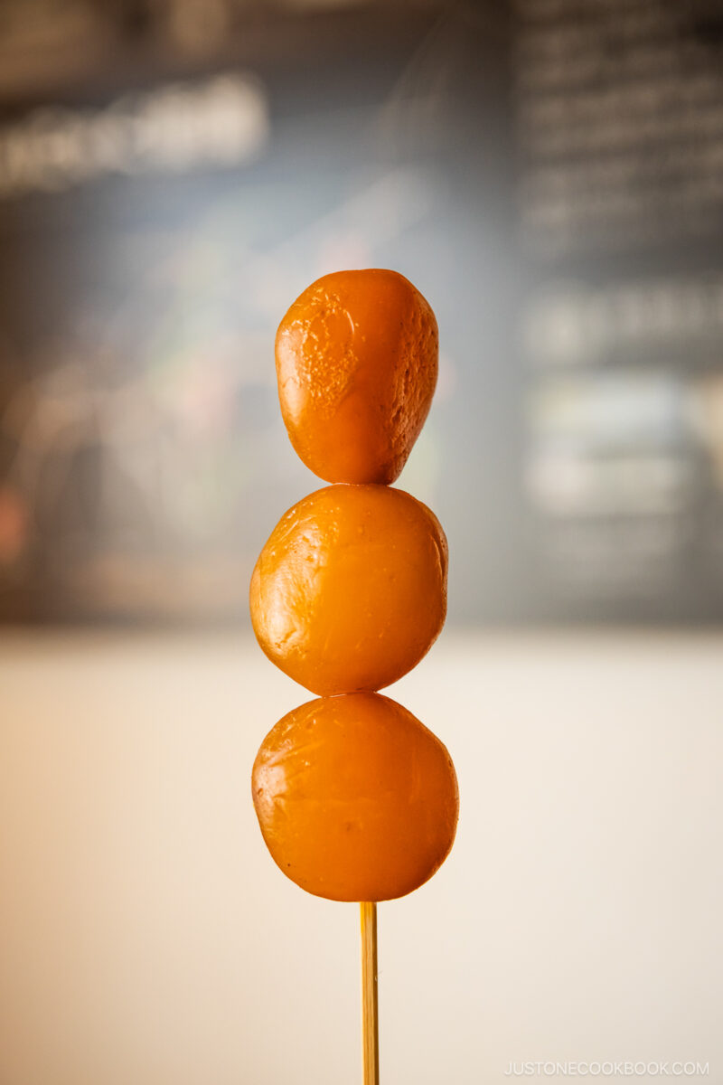 Three konnyaku balls on a skewer