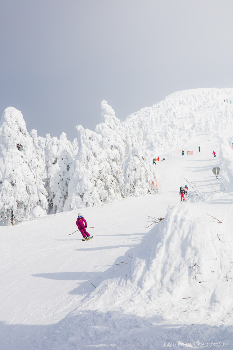 People skiing down mountain