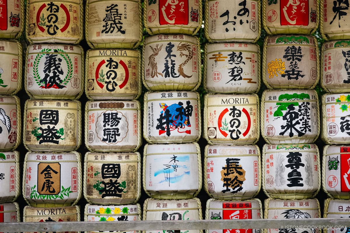 sake barrels stacked on top in a row