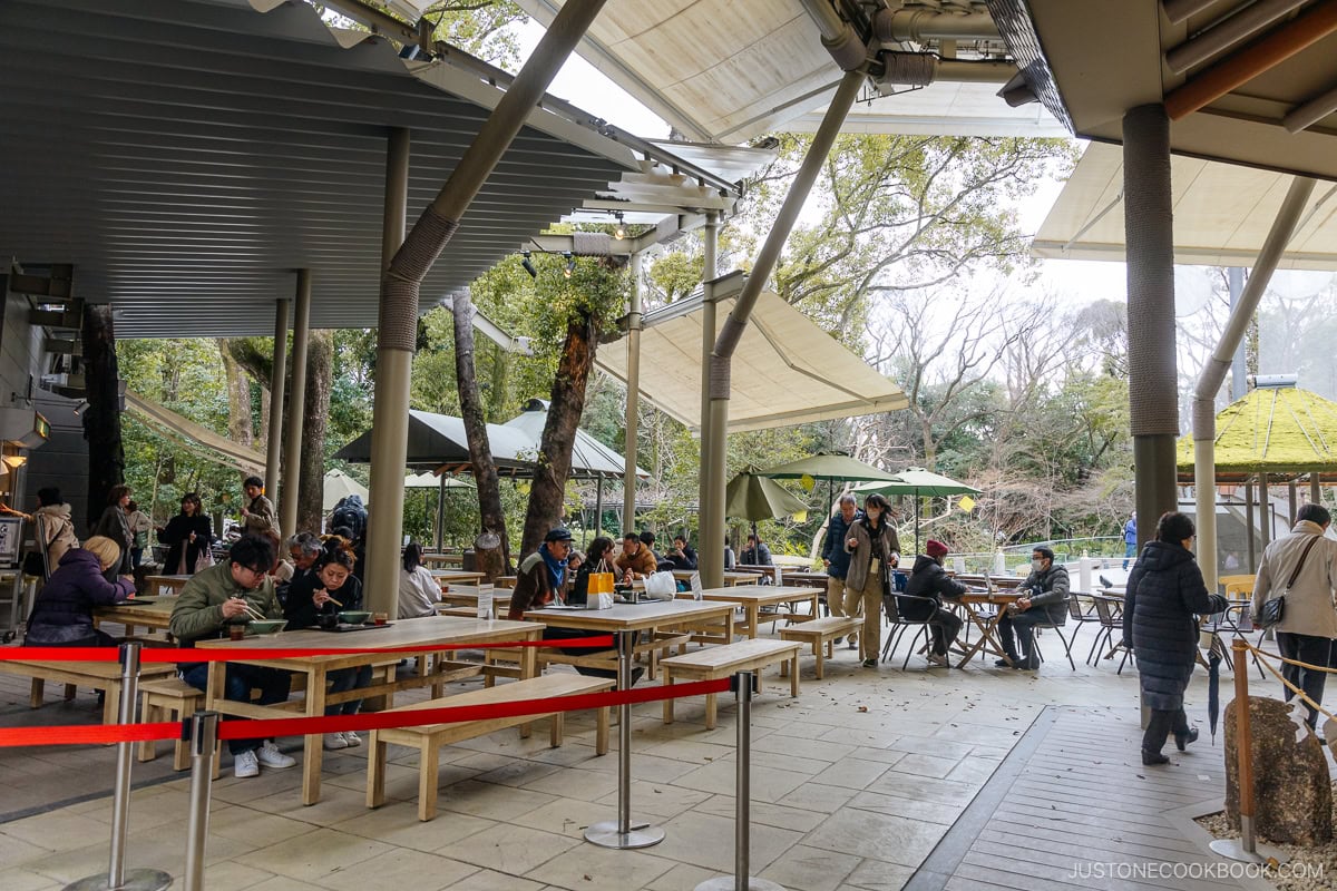 sitting area for the restaurant with tables and benches