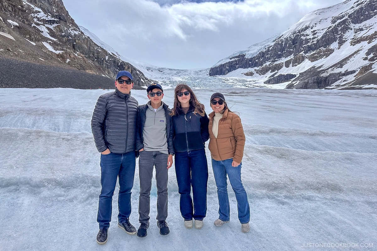four people standing on the Athabasca Glacier