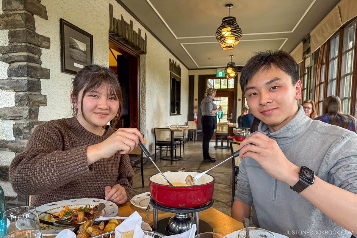 two people eating fondue