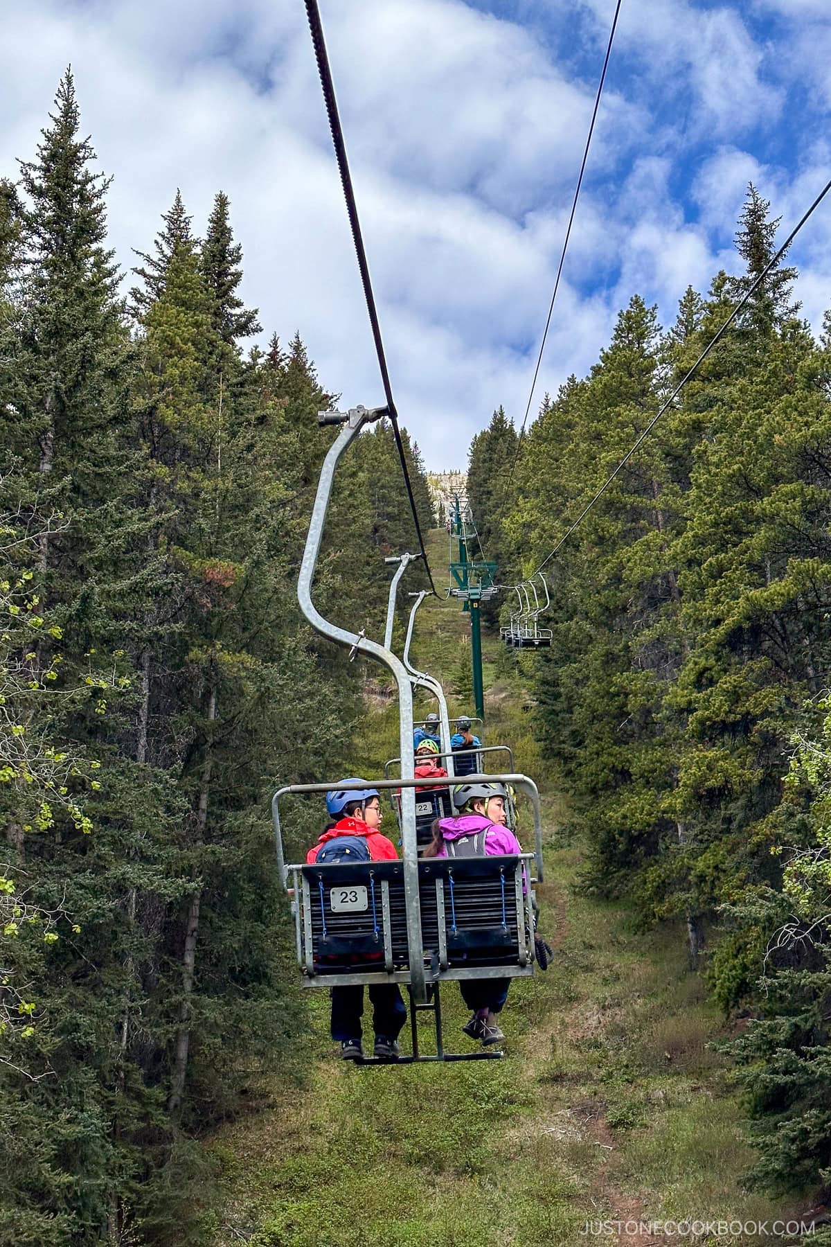 people riding on a ski lift